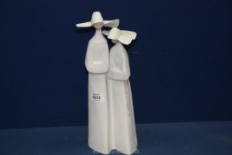 Two matt finish Lladro figures of Nuns, 13" tall.