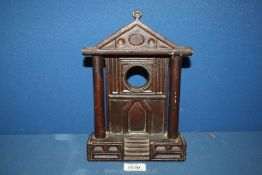 A Folk art carved sandstone watch stand, possibly Welsh, in the shape of a pillared chapel facade,