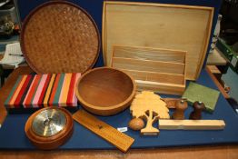 A box of treen to include; a wooden tray, woven bamboo tray, letter rack, crib board, barometer,