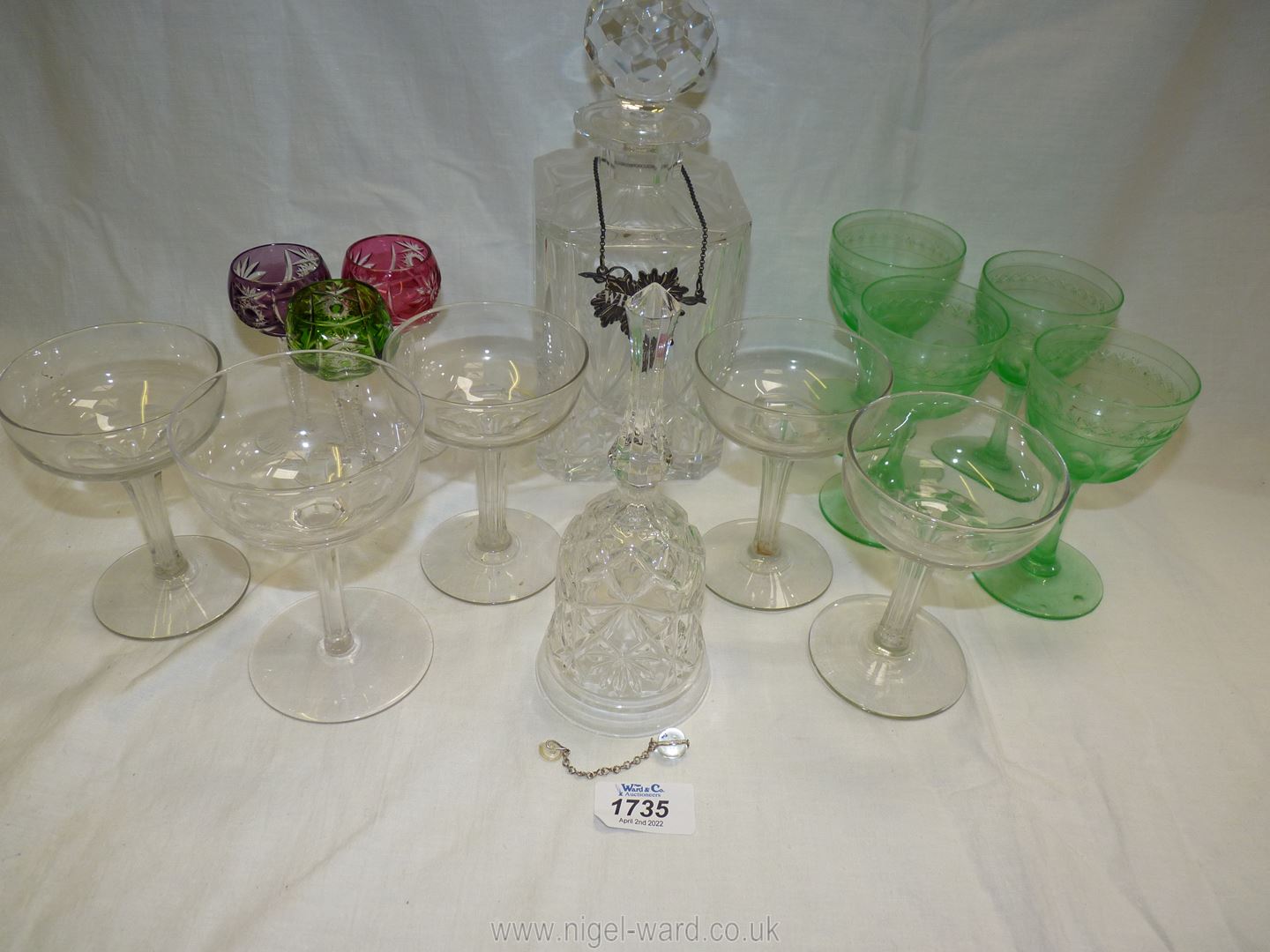 Five champagne glasses, green wine glasses, bell, decanter with stopper etc.