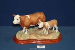 A Border Fine Arts A1253 Simmental Cow and calf by Studios 2002, with box.