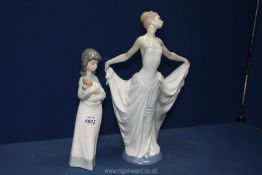 A Lladro figure of a dancer 12" tall (thumb missing) together with A Nao figure of a girl holding a