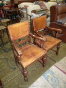 A pair of Oak framed study Chairs having studded leather upholstered seats and backs and standing