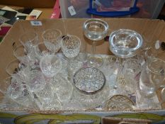 A quantity of glass and cut glass including twisted stem champagne flutes and sherry glasses,