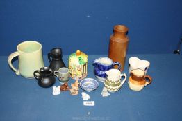 A small quantity of mixed pottery including dragon pottery jug, Prinknash jugs,