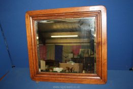 A wooden framed bevel plated wall mirror, 22" x 20".