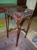 A darkwood Chinoiserie occasional Table standing on canted square legs terminating in spade feet