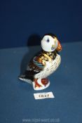 A Royal Crown Derby Puffin paperweight with gold stopper.