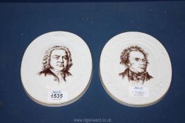 A pair of Meissen commemorative oval Plaques for 'Franz Schubert 1797-1828' and 'Johann Sebastian