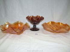 A vintage iridescent 'Peacock and Urn' carnival glass ruffled bowl by Millersburg,