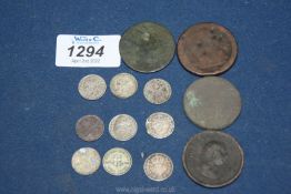 Four old cartwheel pennies and eleven silver 3d pieces.