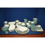 A quantity of Denby Pottery to include casserole dish, various serving dishes, jugs and cups, etc.