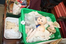 A quantity of porcelain doll's heads and limbs, for construction, with instructions.
