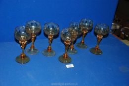 A set of seven fine Venetian amber coloured glass hock glasses.