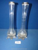 A pair of bud vases with silver rims, hallmarks for London 1925, makers William Gander Groves,