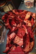 A large red patchwork throw, 92" x 106".