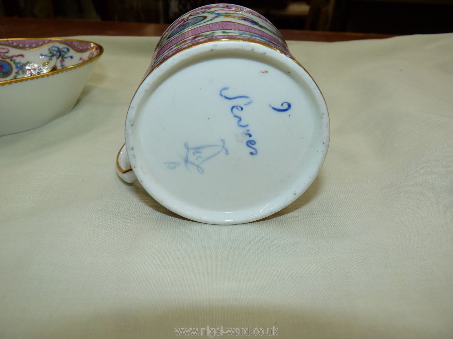 A Sevres coffee can and saucer, painted with floral garlands against a mottled salmon pink ground, - Image 13 of 13