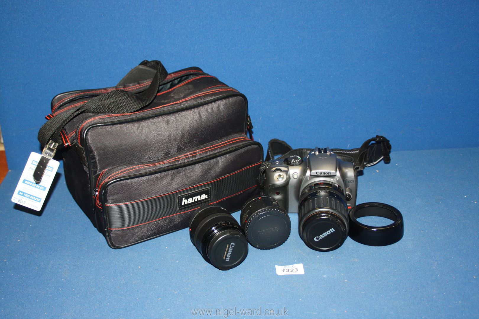 A Canon EOS Digital Rebel camera and 35-135 f/4 -5.6 zoom lens with a 50mm f/2.