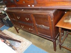 A 1930/40's Mahogany Sideboard with a pair of central drawers flanked by a cupboard on either side