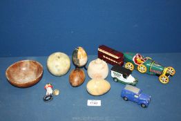 A small quantity of Onyx eggs and an apple, boxed metal wind up car, Doncaster bus, Tetley van etc.