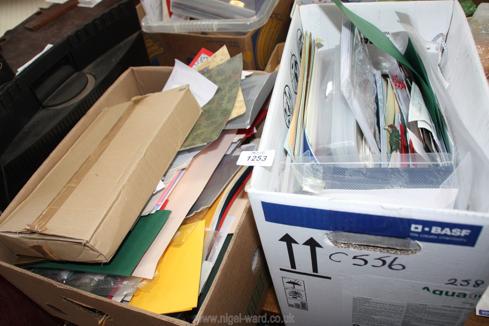 Two boxes of card envelopes and craft paper.