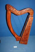 A twelve string Folk Harp in case