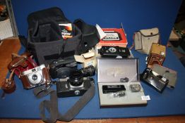 A quantity of cameras and accessories including cased Chinon C5 35 mm SLR and pro-990c flash,