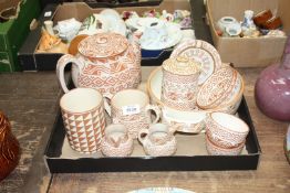 A quantity of Mexican Aztec design pottery by Jeneivez in cream and brown including large teapot,