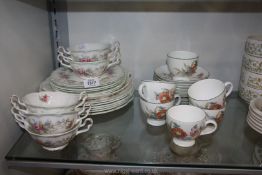 A Royal Albert 'Colleen' part Dinner service including dinner plates, side plates, soup bowls, etc.