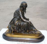 A heavy bronze figure of Cleopatra sitting on a swan legged stool by Henry Etienne Dumaige