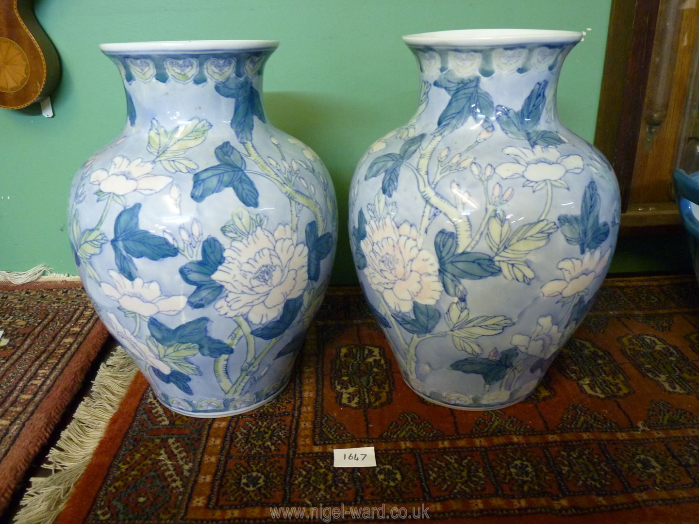 A pair of Satsuma style vases with floral pattern in pale blue and green, 12 1/2'' tall.