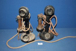 Two G.P.O candlestick telephones.(dials missing), 12'' tall.