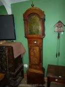 A Mahogany cased eight day Longcase Clock having an arched brass face with inset second hand and