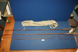 Two cane Fishing Rods in case, with cork handles and one by Allcocks.
