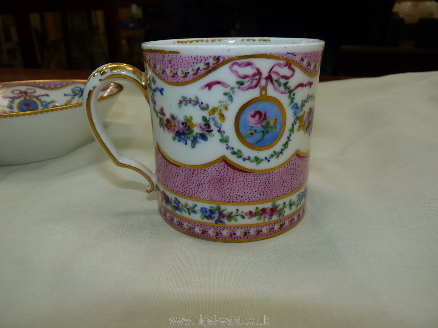 A Sevres coffee can and saucer, painted with floral garlands against a mottled salmon pink ground, - Image 8 of 13