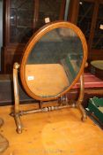 A dressing table Mirror with scrolled feet, 20 1/2" wide x 28" high.