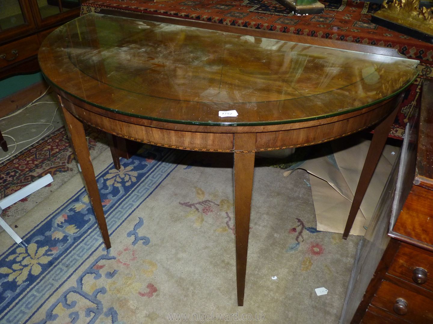 A Mahogany/Walnut "D" shaped side Table having a cross-banded top,