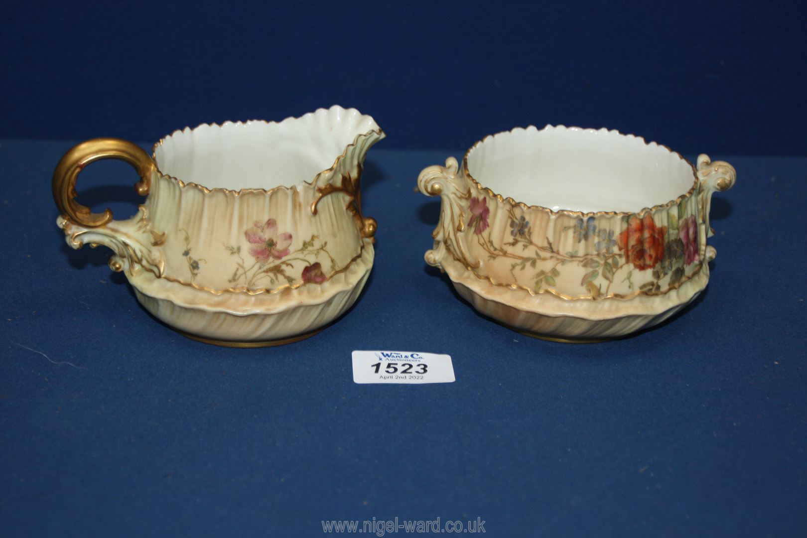 A Royal Worcester blush milk jug and sucrier reg. no.