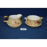 A Royal Worcester blush milk jug and sucrier reg. no.