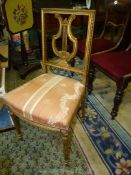 A pretty gilded framed lyre-back Side Chair having turned and fluted legs,