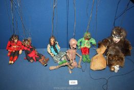 A quantity of puppets including skeleton, devil, witch etc.