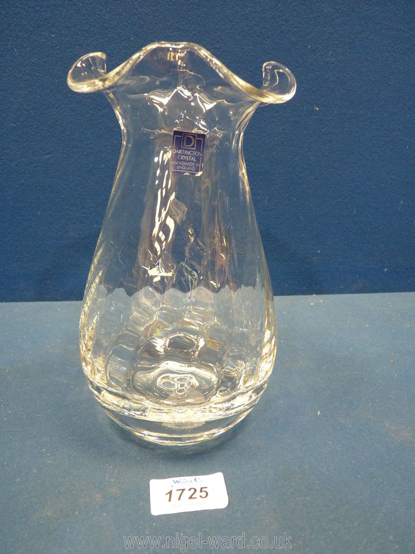 A heavy Dartington swirled crystal glass vase with wavy rim and label.