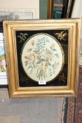 A gilt framed hand embroidered scene of flowers, 16'' x 14 1/4'' .