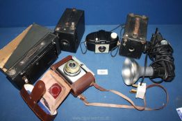A quantity of cameras including Kodak 120, Ilford Super Sporti, Kodak 127 Brownie etc.