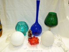 A quantity of coloured glass including large green goblet, tall blue vase, red and green decanter,