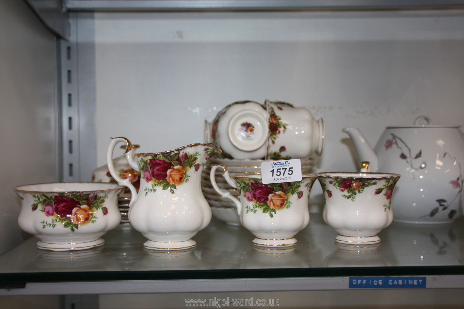 A Royal Albert 'Country Roses' part Teaset including six cups, nine saucers, milk jug, etc.