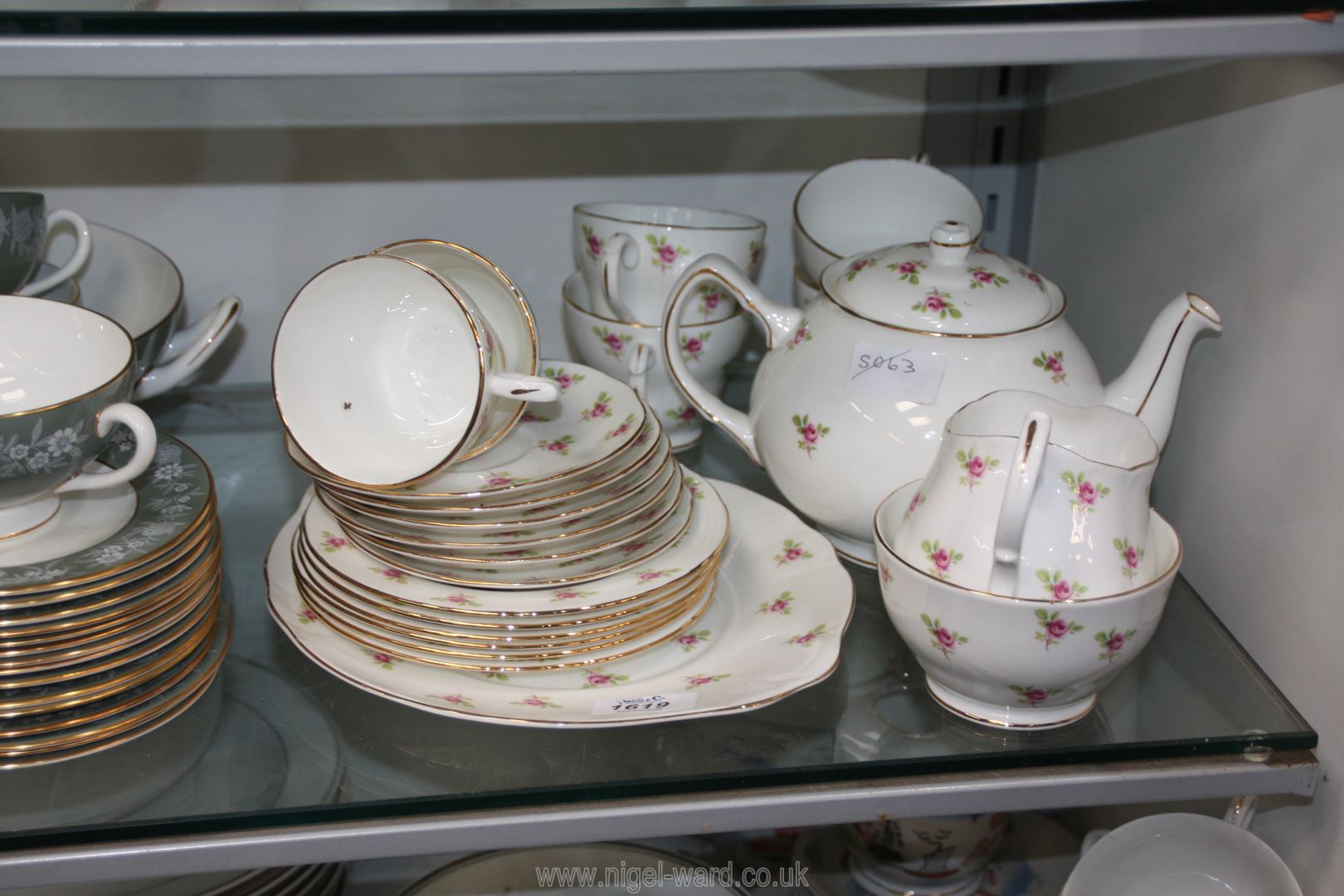 A Duchess Teaset, white ground in pink rose decoration comprising six cups and saucers, side plates,