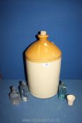A large Stoneware flagon (2 gal), small earthenware mortar and three glass medicine bottles.