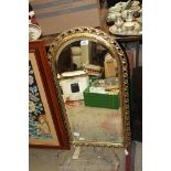A gilt Mirror with oval top, approx. 18 1/2" x 33 1/2".