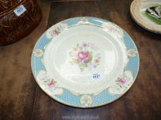 A large Myott pottery plate with floral pattern to centre.